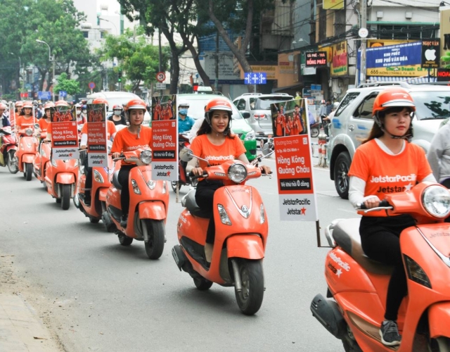 Trang trí xe chạy roadshow: Báo giá in ấn thi công xe đạp và xe máy tại tpHCM